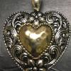 Gold and silver tone heart